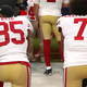 Eric Reid, No. 35, and Colin Kaepernick, No. 7, both then of the San Francisco 49ers, kneel in protest during the national anthem prior to playing the Los Angeles Rams in their NFL game at Levi’s Stadium on Sept. 12, 2016, in Santa Clara, Calif. (Thearon W. Henderson/Getty Images)